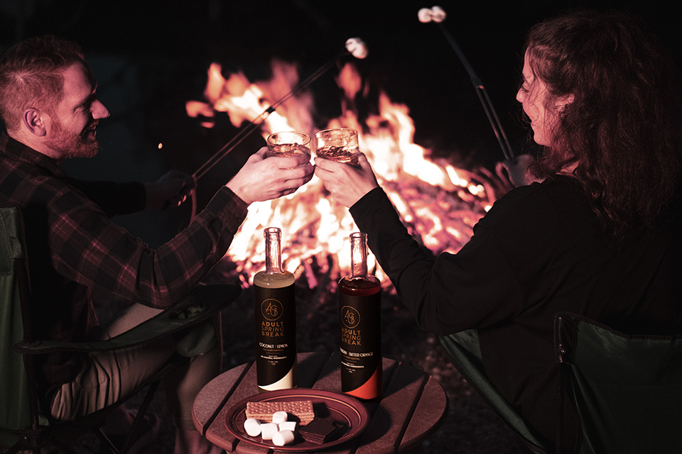 Couple Cheers at Night by Fire